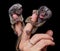 The common marmoset`s babies on fingers isolated on black