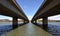 Commonwealth Bridge over Lake Burley Griffin in Australia capital city Canberra. Australian Parliament House at the end of the