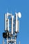 Communication Cell phone tower on blue sky background