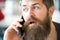 Communication concept. Man with beard and mustache mobile phone conversation defocused background. Bearded man hold