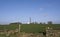 A communication Mast with Satellite Dishes alongside in the Scottish Countryside near a very minor road.