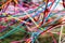 Communication and network concept. Everyone is connected represented by colorful strips of fabric intertwined