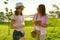 Communication of the parent and adolescent. Mother talks to her daughter teenager, takes out purse with money from her bag. Backgr