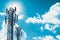 Communication tower or 3G 4G network telephone cellsite silhouette on blue sky