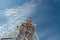 Communication tower against blue sky.