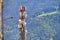 Communication tower for cellular television and wireless broadcasting under nature mountain background