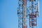 Communication tower metal frame isolated on blue sky