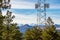 Communication tower with pine trees and the mountain ridge in the backround. Lookout Mountain Nature Center and Preserve, Golden,