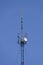 Communication tower with repeaters and satellite dish