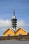 Communication tower and wooden houses