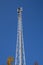 Communication transmission tower against blue sky