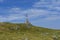 Communications cellular telecoms communications antenna in the top of the mountains with rusty communication shelter .