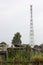 Communications tower in remote village among old poor houses. In