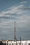 A communications tower standing high above city townhomes