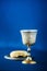 Communion still life. Unleavened bread, chalice of wine, silver kiddush wine cup on blue background. Christian communion concept