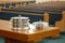 Communion Trays on Table Before Empty Church Pews