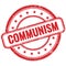 COMMUNISM text on red grungy round rubber stamp
