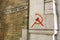 Communist Hammer and Sickle Symbol Painted onto the Wall of a Bank in Red Paint