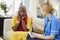 Community Nurse Visits Senior Woman Suffering With Depression