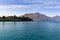 Community Park on the shore of Lake Wakatipu with back drop of the Southern Alps Queenstown, Otago, New Zealand