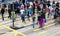 Commuters crossing a busy crosswalk