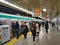 Commuters leave a crowded train on the busy subway / underground at a station in Kyoto, Japan