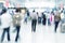 Commuters in motion blur, airport interior