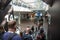 Commuters passengers on escalator inside a modern railway station terminal