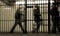 Commuters in a subway cage; New York City