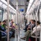 Commuters in subway wagon.