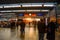 Commuters talk while waiting for their train to arrive