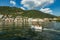 Como, ITALY - August 4, 2019: Apartments, villas, hotels on the green forested mountainsides near Lake Como. Beautiful Italian