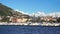 Como, Italy - September 12, 2017: a scenic Italian village at bank of big mountain lake with ships moored, Como, Italy