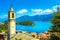 Como Lake, Sala Comacina bell tower from greenway trail. Italy.