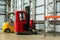 Compact forklift trucks in a industrial warehouse building