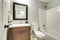 Compact light bathroom with soft gray walls