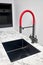 Compact undermount square stainless steel sink with red tap in contemporary style. Water faucet sink built in compact