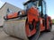 Compactor - Heavy Vibration roller for asphalt works and road repair. Road roller. Excavation, construction, asphalt paving works