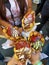 Company of friends arranged in a circle enjoying 4 cones of waffle bubble ice cream