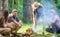 Company friends prepare roasted marshmallows snack nature background. Camping activity. Roasting marshmallows popular