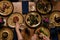 Company gathering for Christmas or New Year party dinner at festive table