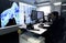 The company\'s employee Gazprom at the workplace behind the monitors