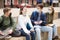 Company of teenagers in protective masks are communicating on walk on street