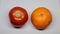 Comparison between fruits and vegetables- tomato vs orange.