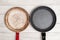 Comparison of pans. Old and new frying pan. New and old damaged non-stick coating