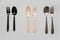 Comparison of reusable metal cutlery, harmful disposable plastic and eco wooden. View from above. Top view. Flat lay