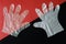 Comparison of silicone and cellophane polyethylene protective gloves. Precautions for COVID-19 pandemic. Black and red diagonal