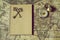 Compass, antique keys and notebook on blur vintage world map, journey concept, copy space