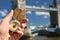 Compass in the hand against Tower bridge