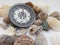 Compass and interesting seashells on a white background on travel and recreation